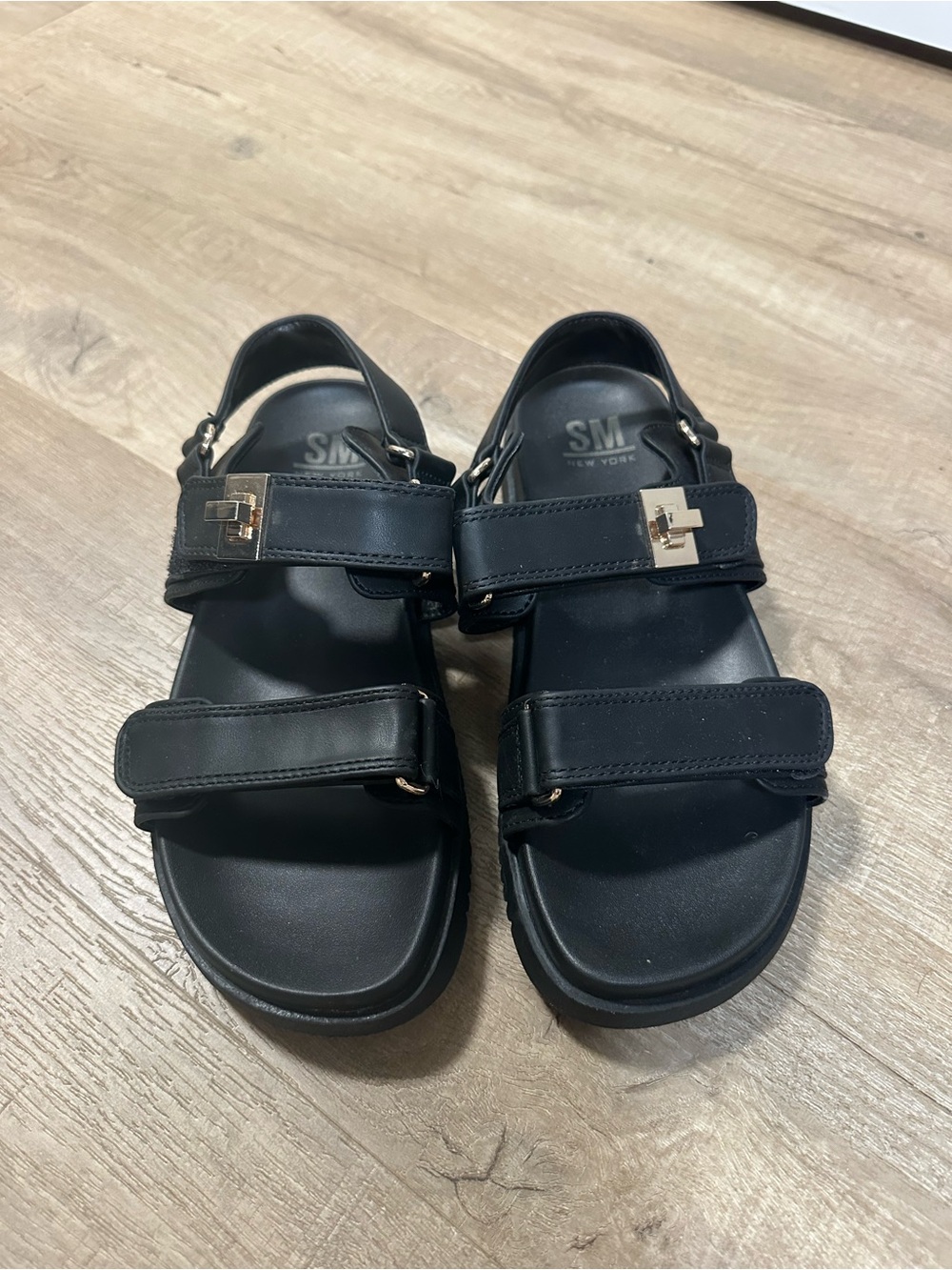SM New York Black Women’s Leather Strappy Sandals with Metal Accent